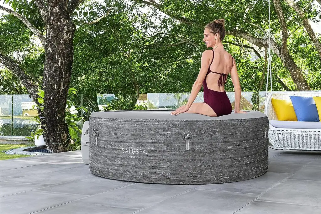 Bestway SaluSpa Budapest Inflatable Hot Tub Spa | Portable Hot Tub with Energy-Efficient Cover | Features Stone Print, Filtered Heated Water System and 140 AirJets | Fits 4-6 People