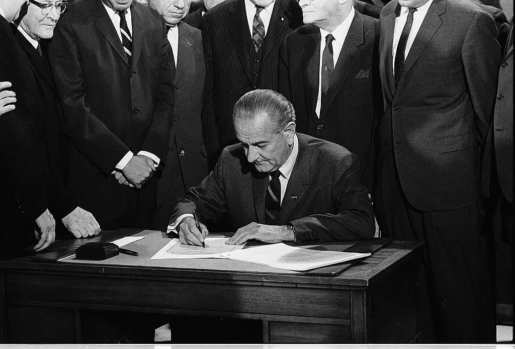 President Lyndon B. Johnson signing the Civil Rights Bill of 1968